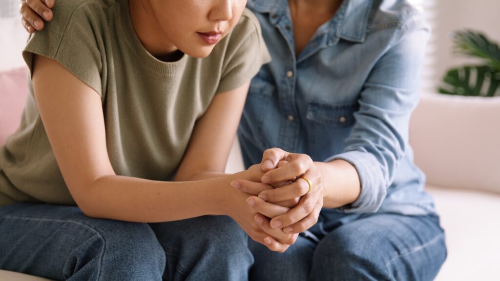 Quiet child/teen with mother