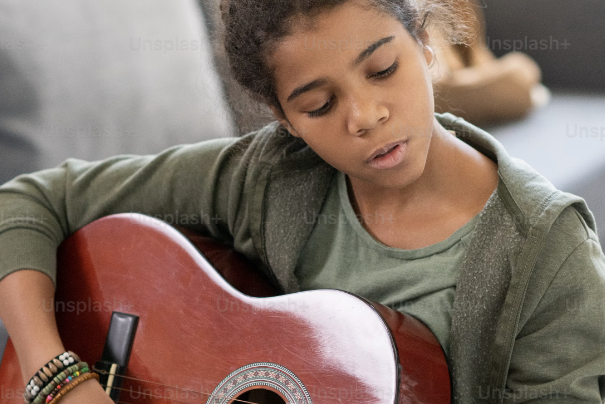 Child playing guitar