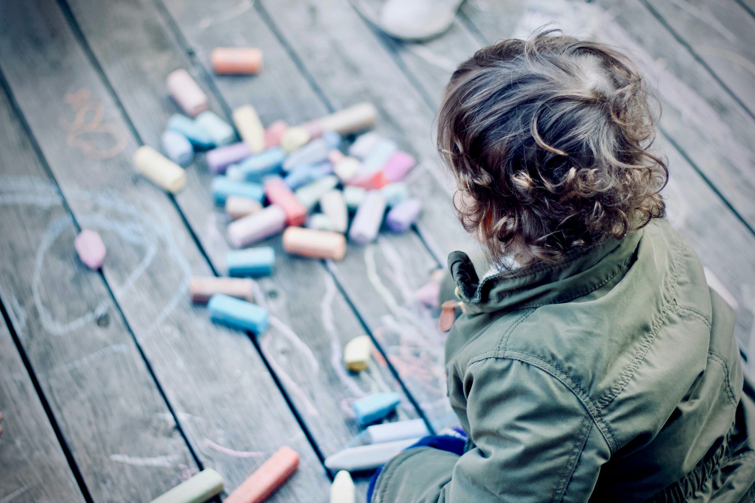 Child writing with chalk